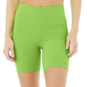 Alo Yoga Green Shorts logo at the front